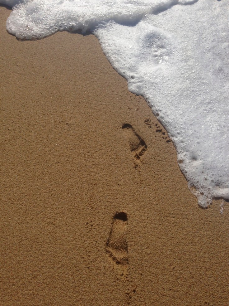 feet in the sands of the ocean