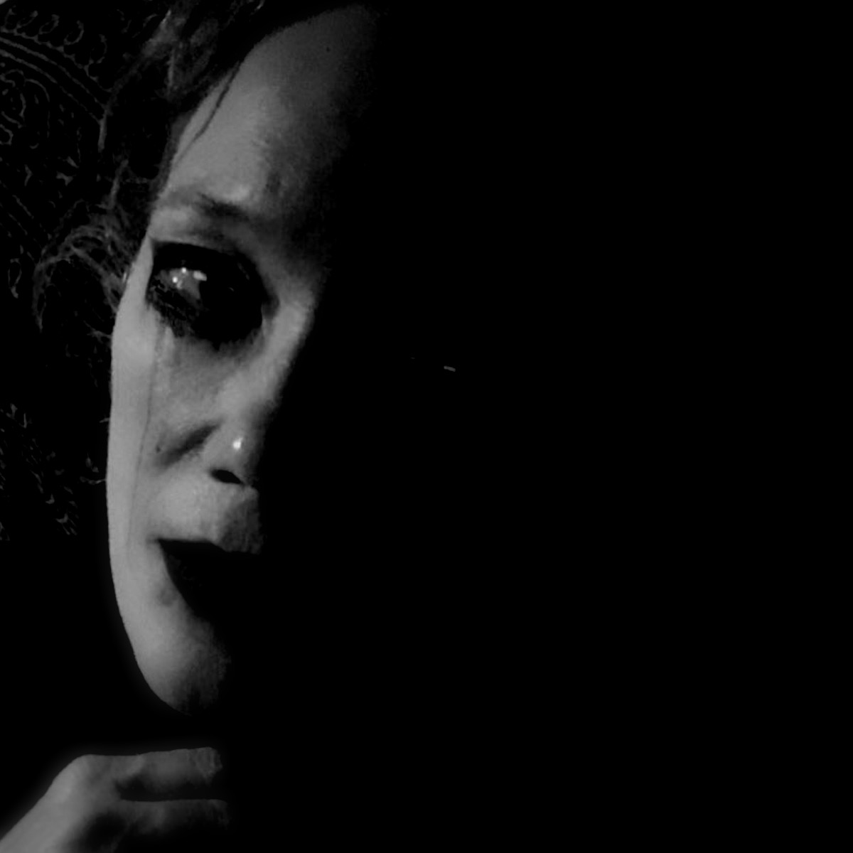 black and white image of girl with raccoon eyes